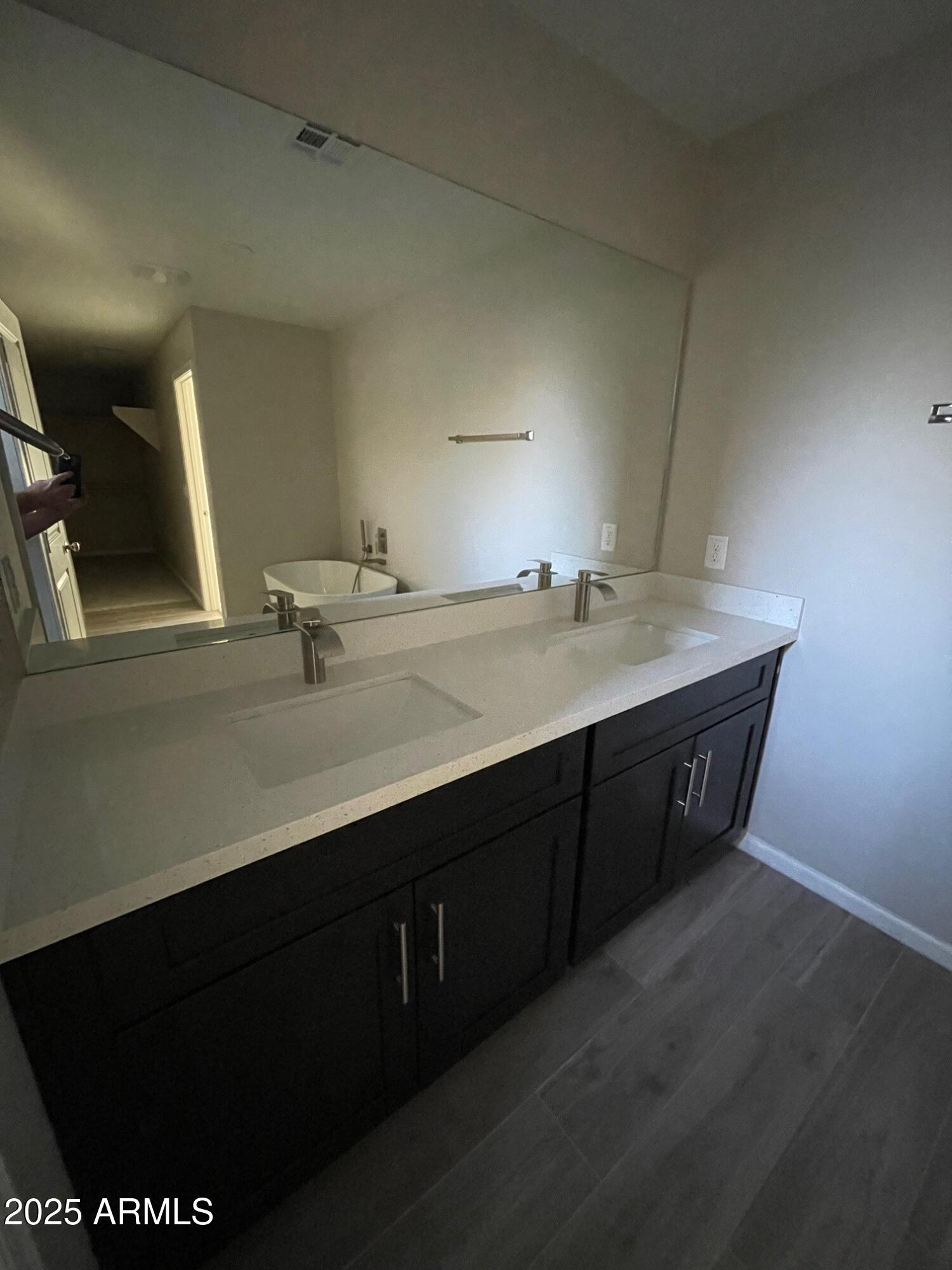 82 West Brooks Street Gilbert, AZ 85233 - Photo 8 of 23 a bathroom with a sink vanity and mirror