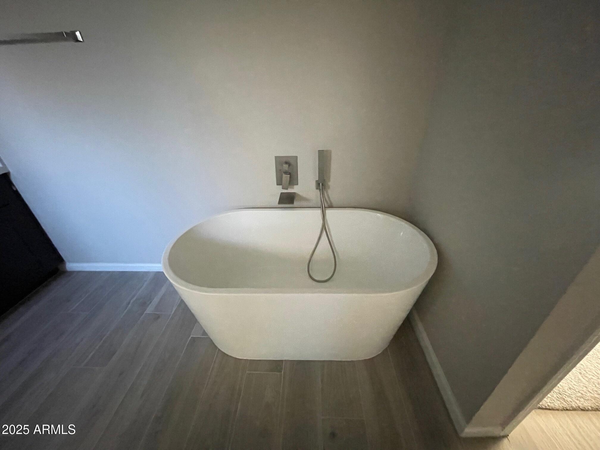 82 West Brooks Street Gilbert, AZ 85233 - Photo 9 of 23 a white bath tub sitting in a bathroom