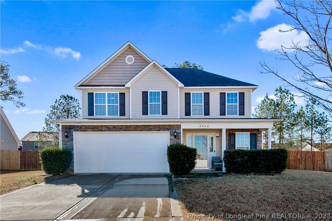 2040 Yellowbrick Road Fayetteville, NC 28314 - Photo 1 of 50 a front view of a house with a yard