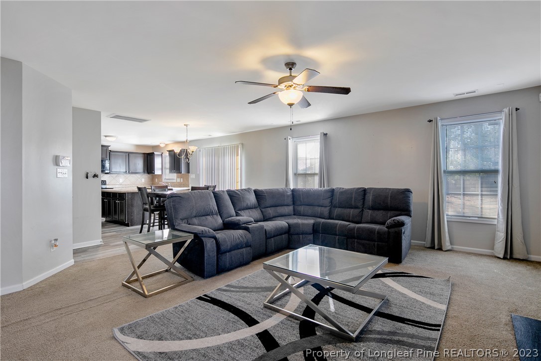 2040 Yellowbrick Road Fayetteville, NC 28314 - Photo 12 of 50 a living room with furniture a ceiling fan and a window