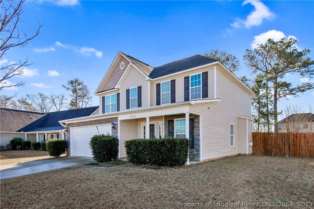 2040 Yellowbrick Road Fayetteville, NC 28314 - Photo 2 of 50 a front view of a house with a yard