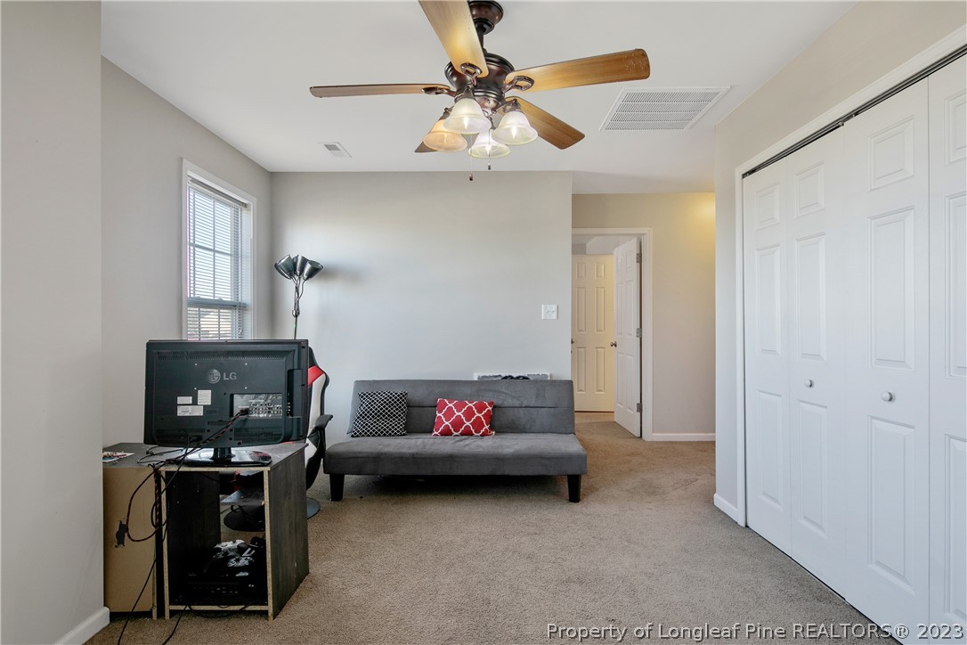 2040 Yellowbrick Road Fayetteville, NC 28314 - Photo 25 of 50 a living room with furniture and kitchen