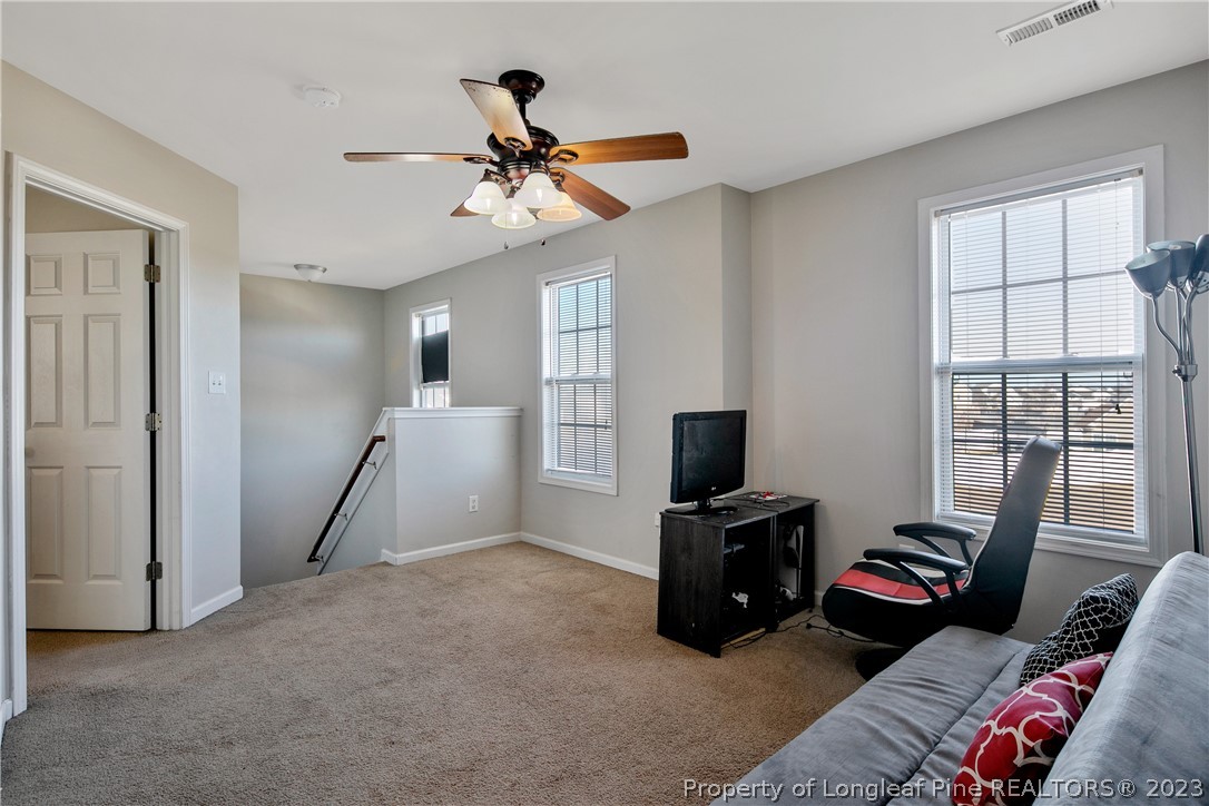 2040 Yellowbrick Road Fayetteville, NC 28314 - Photo 28 of 50 a living room with furniture and a flat screen tv