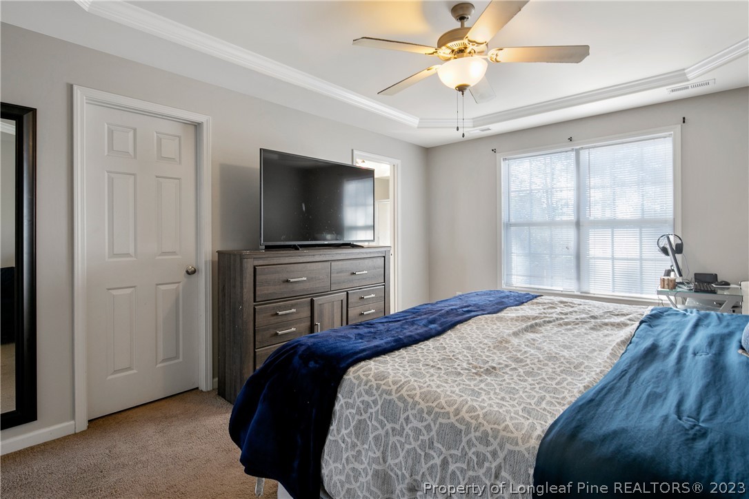 2040 Yellowbrick Road Fayetteville, NC 28314 - Photo 32 of 50 a bedroom with a bed and a flat screen tv
