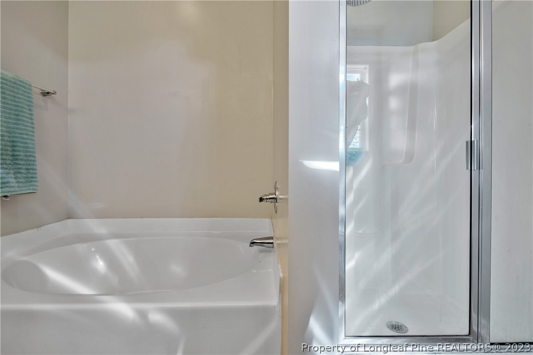 2040 Yellowbrick Road Fayetteville, NC 28314 - Photo 35 of 50 a bathroom with a bathtub