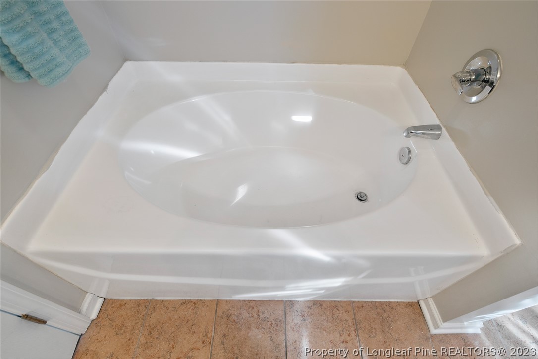 2040 Yellowbrick Road Fayetteville, NC 28314 - Photo 36 of 50 a bathroom with a white bath tub