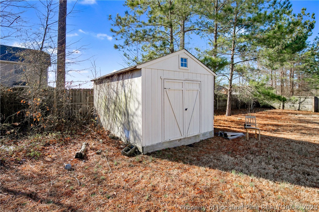 2040 Yellowbrick Road Fayetteville, NC 28314 - Photo 50 of 50 a backyard of a house with yard and outdoor seating