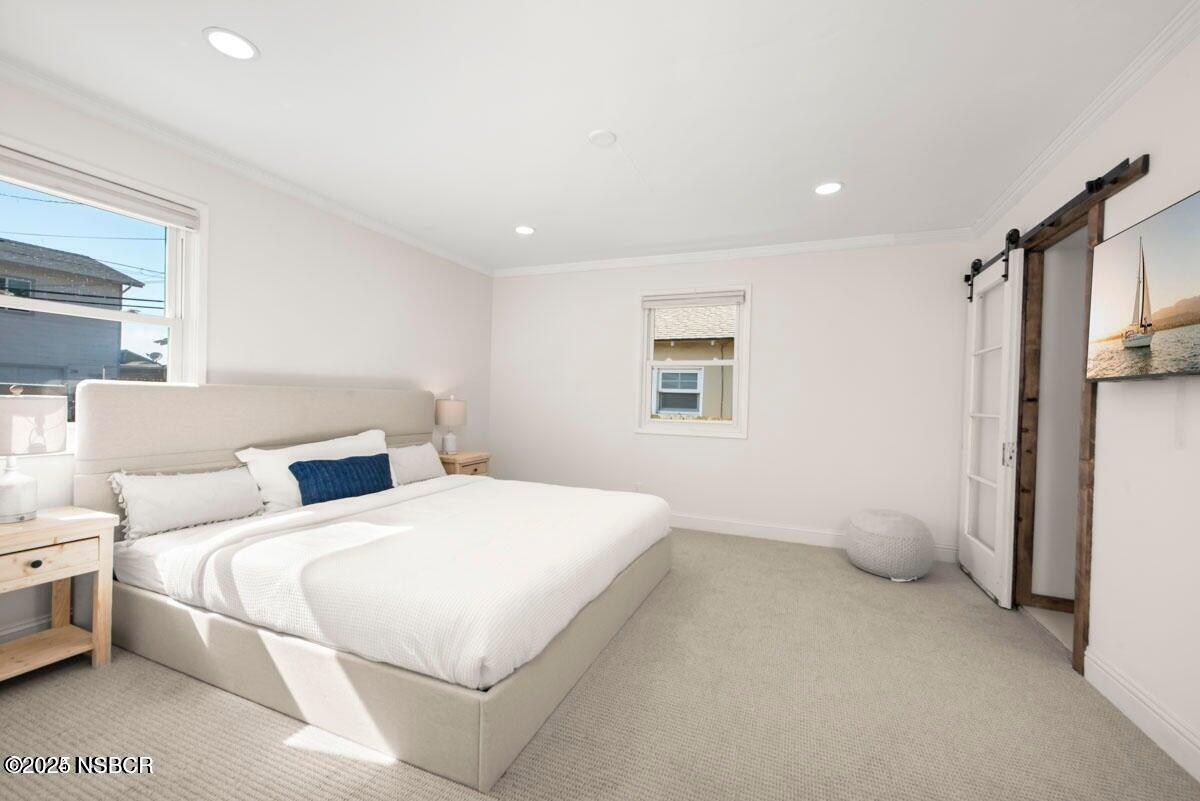 215 South H Street Lompoc, CA 93436 - Photo 16 of 24 a bedroom with a bed and a window