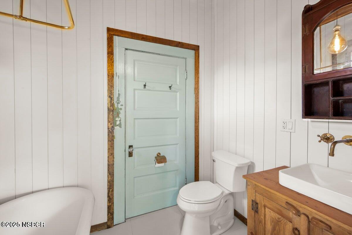 215 South H Street Lompoc, CA 93436 - Photo 17 of 24 a bathroom with a sink a toilet and shower