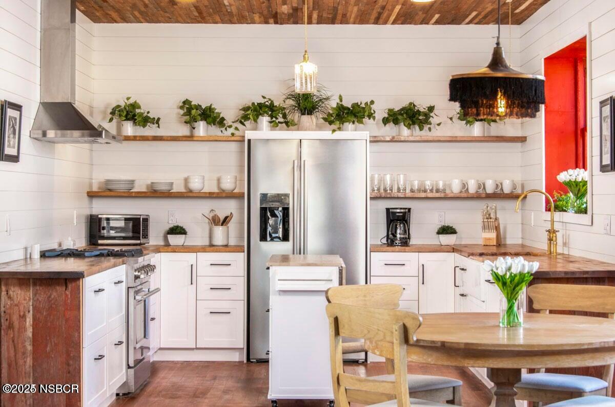 215 South H Street Lompoc, CA 93436 - Photo 5 of 24 a view of living room with furniture and wooden floor
