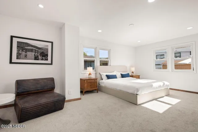 a bedroom with bed and window