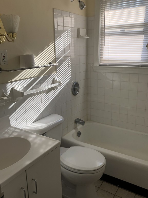 27 George Road, Unit 27 Winchester, MA 01890 - Photo 12 of 30 a white toilet sitting next to a bath tub