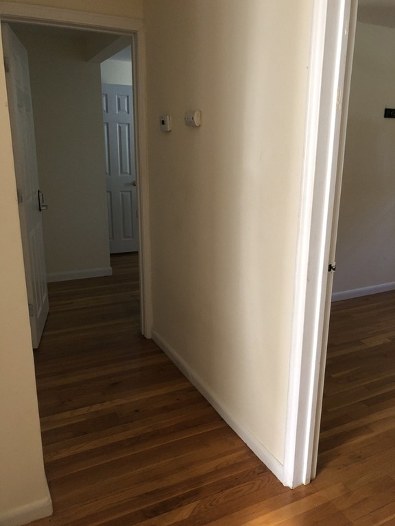 27 George Road, Unit 27 Winchester, MA 01890 - Photo 7 of 30 a view of entryway with wooden floor