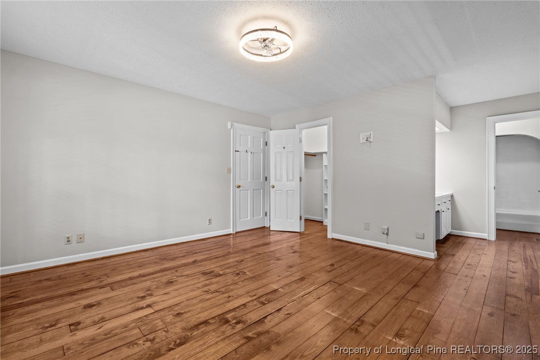 610 Maynard Lake Road Erwin, NC 28339 - Photo 18 of 49 a view of room with wooden floor