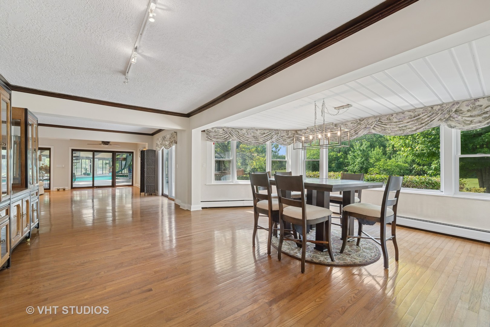153 Algonquin Road Barrington Hills, IL 60010 - Photo 21 of 95 a dining room with furniture window and wooden floor
