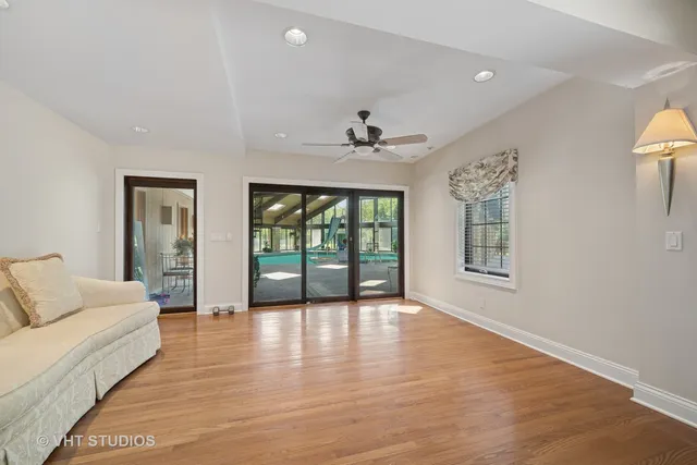 a view of balcony with wooden floor and fence