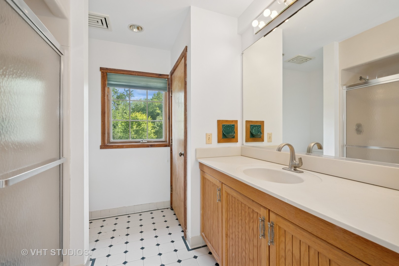 153 Algonquin Road Barrington Hills, IL 60010 - Photo 30 of 95 a bathroom with a sink a vanity and a mirror