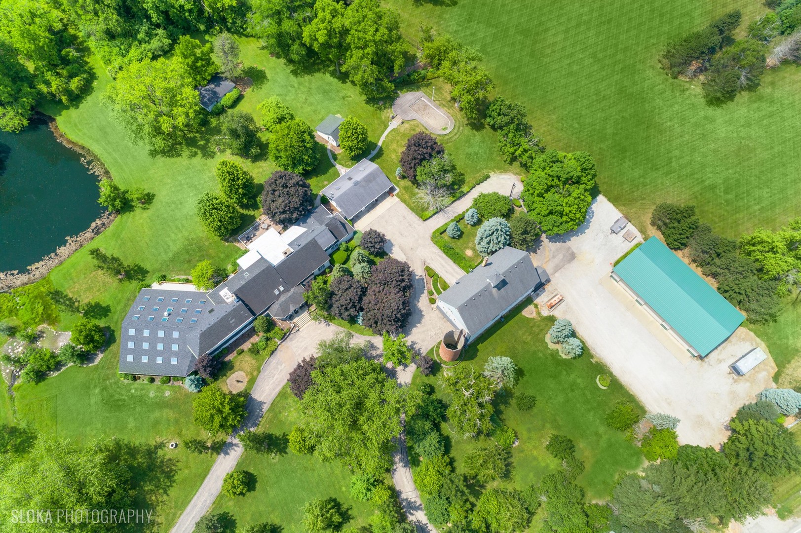 153 Algonquin Road Barrington Hills, IL 60010 - Photo 3 of 95 an aerial view of residential house with outdoor space and trees all around