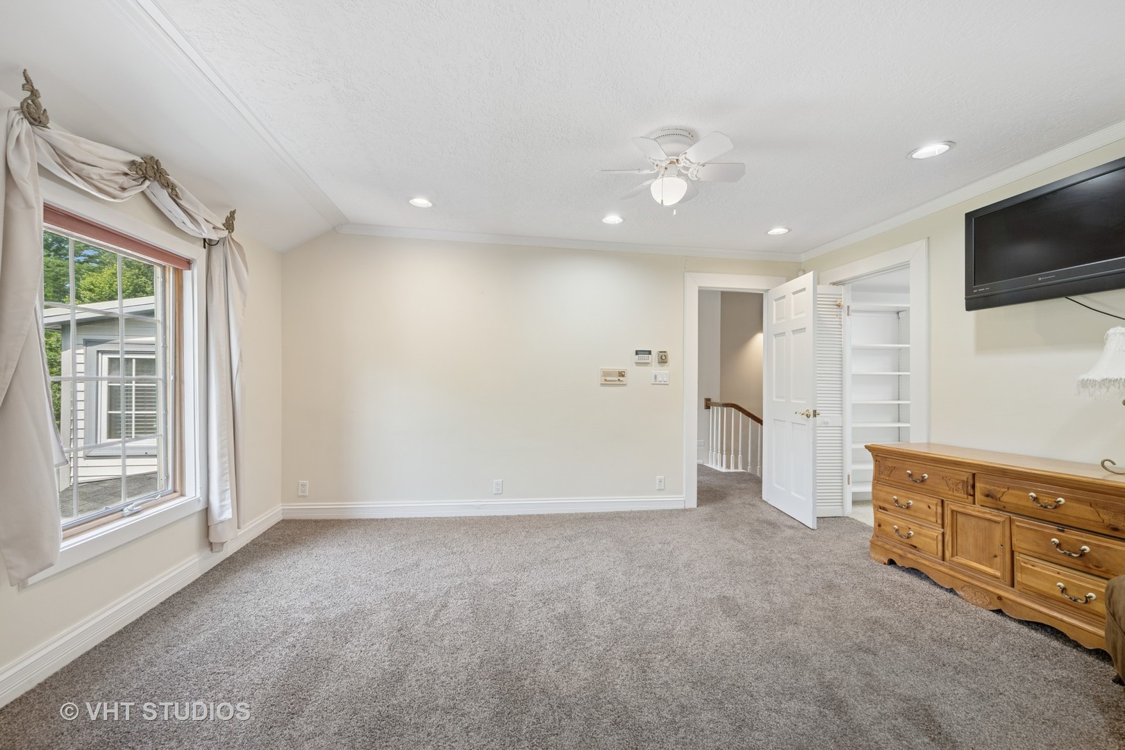 153 Algonquin Road Barrington Hills, IL 60010 - Photo 45 of 95 a view of an empty room with a cabinet and a flat screen tv