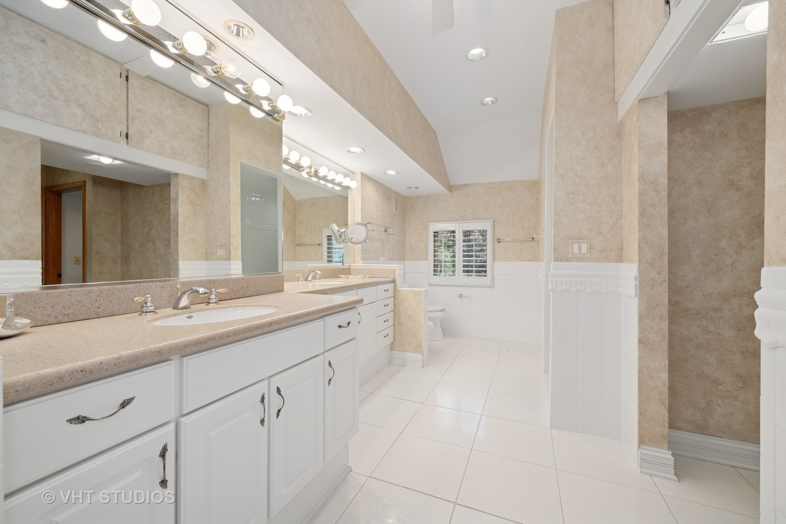 153 Algonquin Road Barrington Hills, IL 60010 - Photo 47 of 95 a spacious bathroom with a granite countertop sink a mirror and a