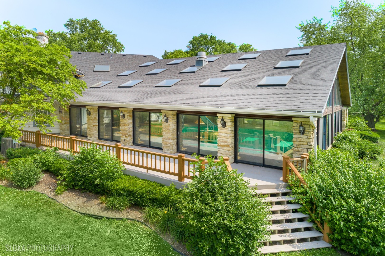 153 Algonquin Road Barrington Hills, IL 60010 - Photo 49 of 95 a view of a house with a yard and sitting area