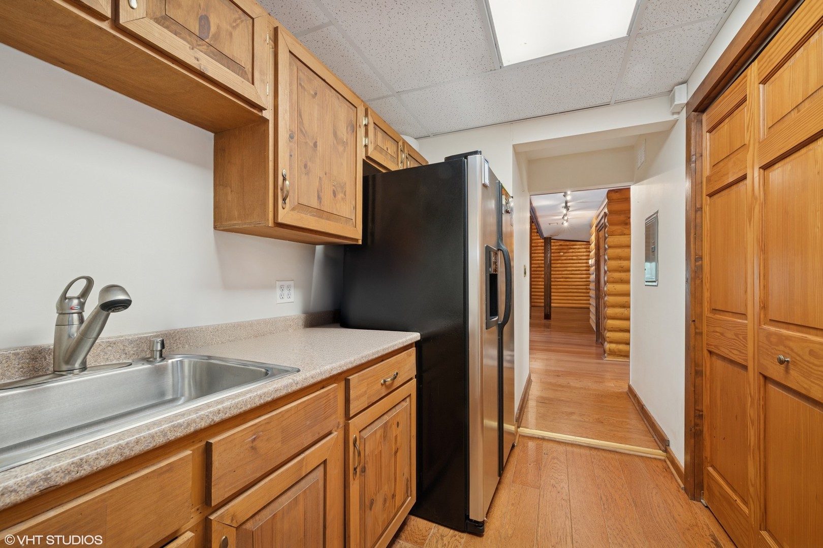 153 Algonquin Road Barrington Hills, IL 60010 - Photo 66 of 95 a kitchen with a refrigerator and a sink