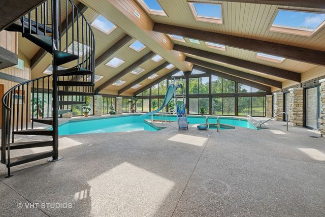 a living room with fireplace furniture and a wooden floor