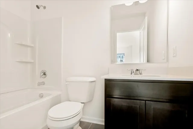 a bathroom with a sink a toilet and a bathtub