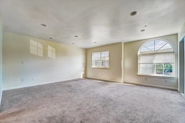 an empty room with windows