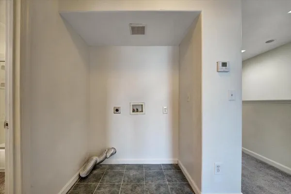 a bathroom with a shower a toilet and a sink