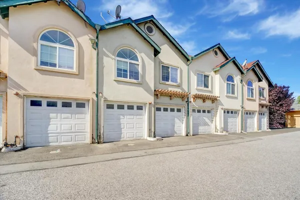 a front view of a building with grey walls