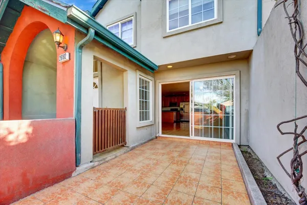 a view of a house with wooden floor and a backyard