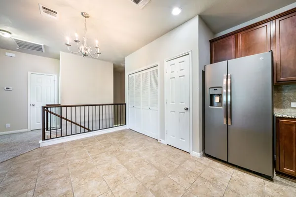 a kitchen with stainless steel appliances granite countertop a stove sink and cabinets