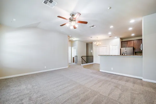 a view of a livingroom with a kitchen