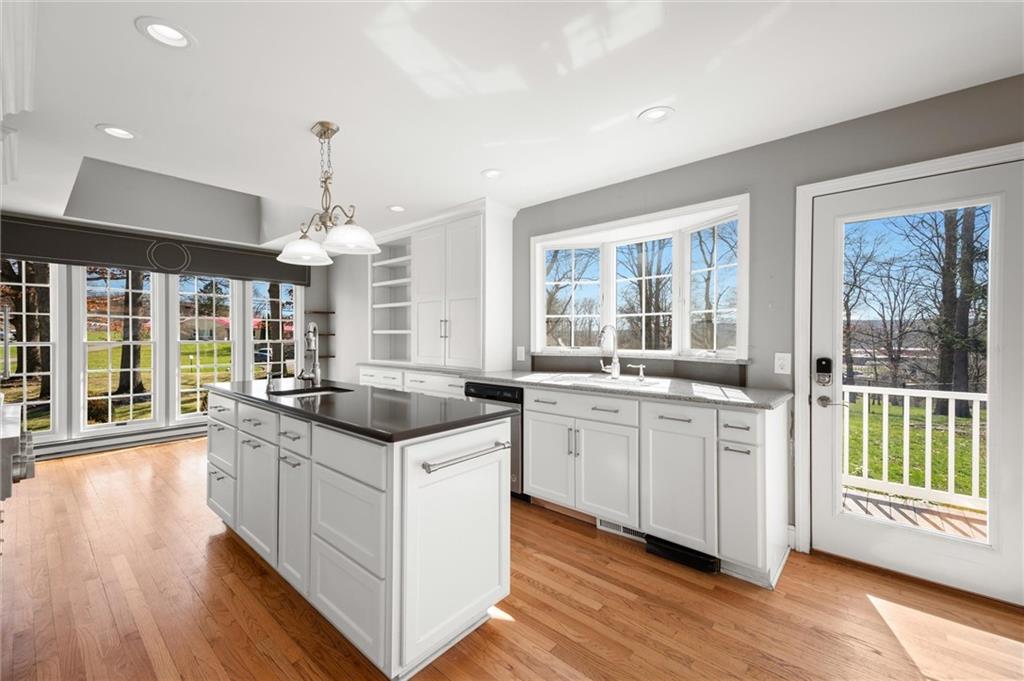 2996 Mercer West Middlesex Road West Middlesex, PA 16159 - Photo 17 of 48 a kitchen with granite countertop counter space a sink appliances and a large window