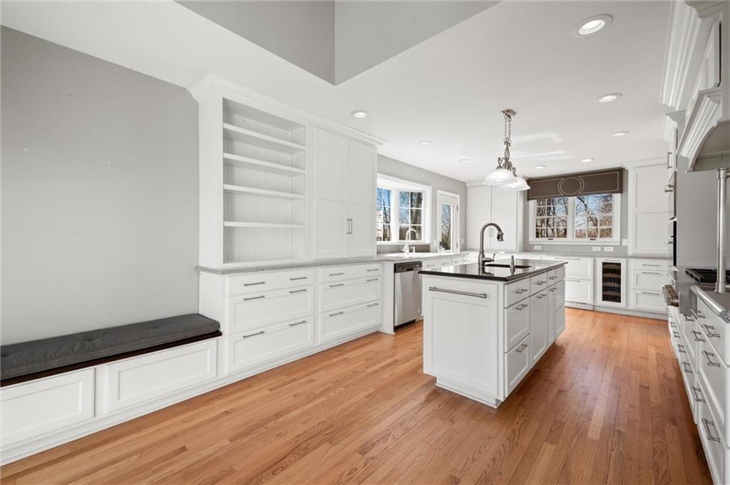 2996 Mercer West Middlesex Road West Middlesex, PA 16159 - Photo 19 of 48 a kitchen with wooden floors and white cabinets