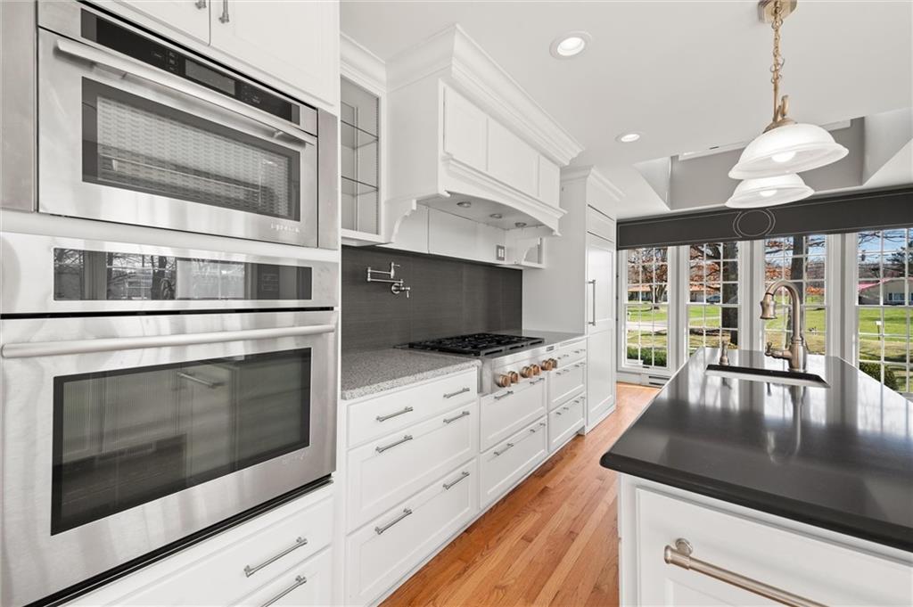 2996 Mercer West Middlesex Road West Middlesex, PA 16159 - Photo 21 of 48 a kitchen with stainless steel appliances kitchen island granite countertop a stove and a microwave