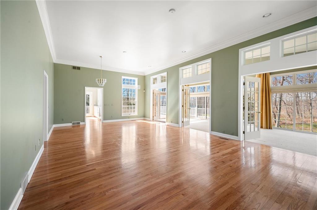 2996 Mercer West Middlesex Road West Middlesex, PA 16159 - Photo 25 of 48 a view of an empty room with wooden floor and a window
