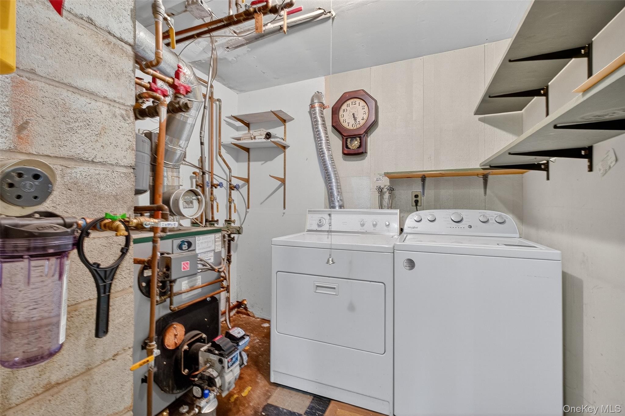 97 Friendly Road Mahopac, NY 10541 - Photo 29 of 49 Laundry room with a heating unit, separate washer and dryer, and concrete floors