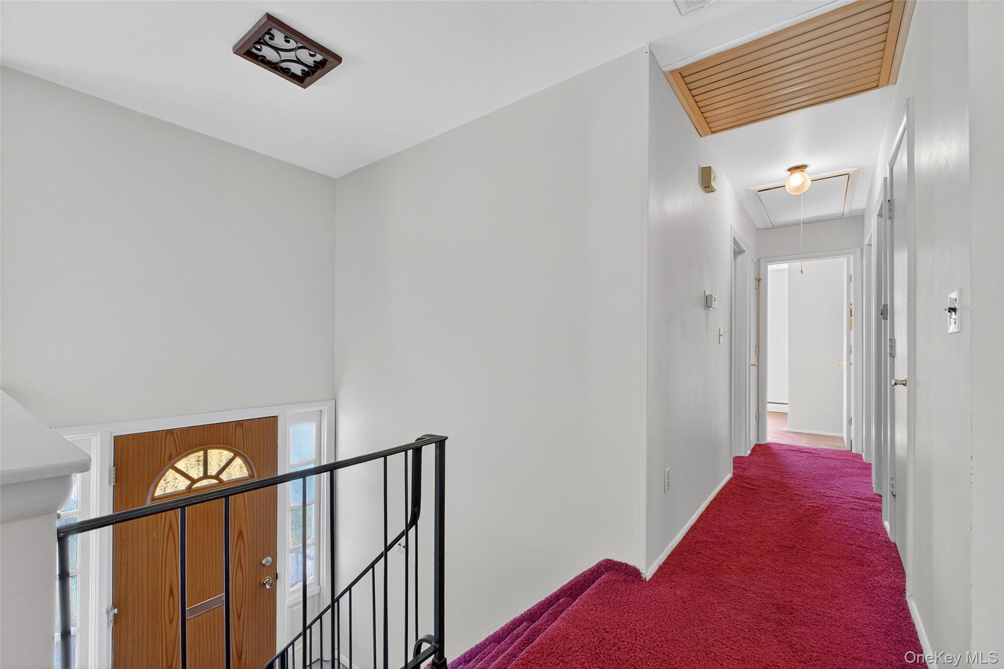 97 Friendly Road Mahopac, NY 10541 - Photo 5 of 49 Hallway featuring, attic access, and an upstairs landing