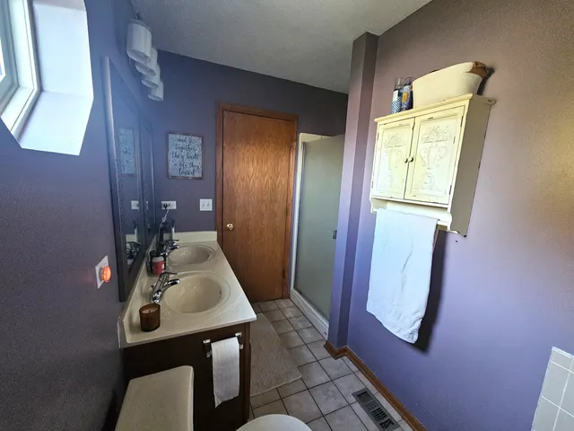 a bathroom with a mirror and a sink