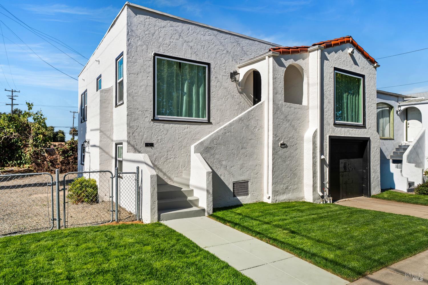 1402 Rice Street Vallejo, CA 94590 - Photo 2 of 55 a front view of a house with a yard