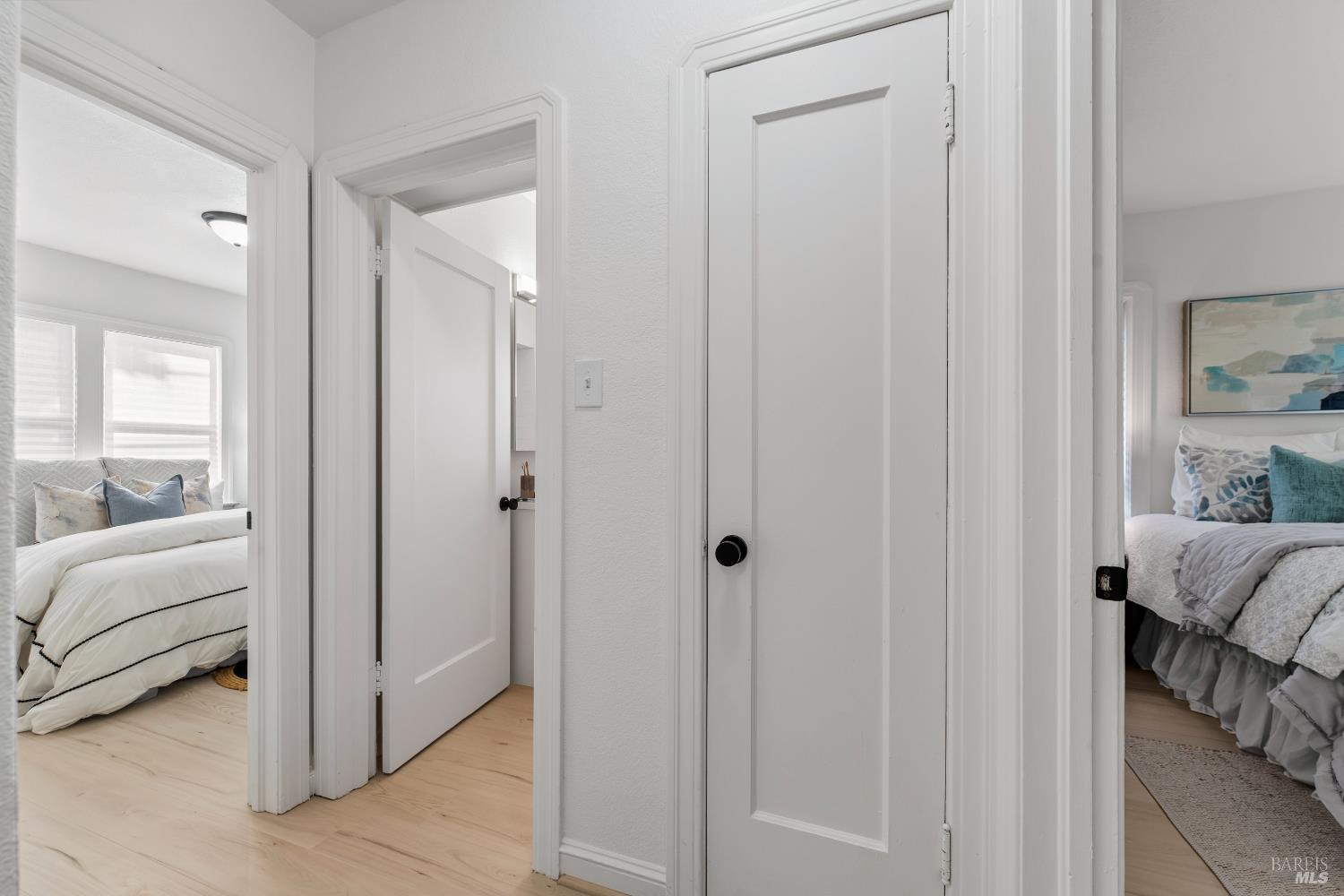 1402 Rice Street Vallejo, CA 94590 - Photo 26 of 55 a view of a bedroom with a bed and wooden floor
