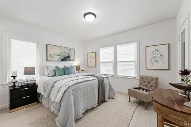 a bedroom with a bed and a couch