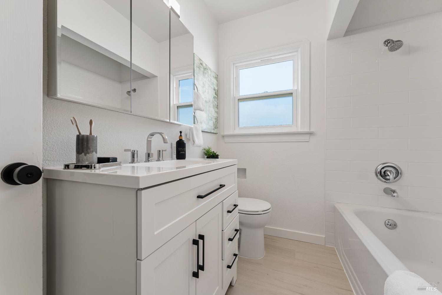 1402 Rice Street Vallejo, CA 94590 - Photo 30 of 55 a bathroom with a sink a toilet and bathtub