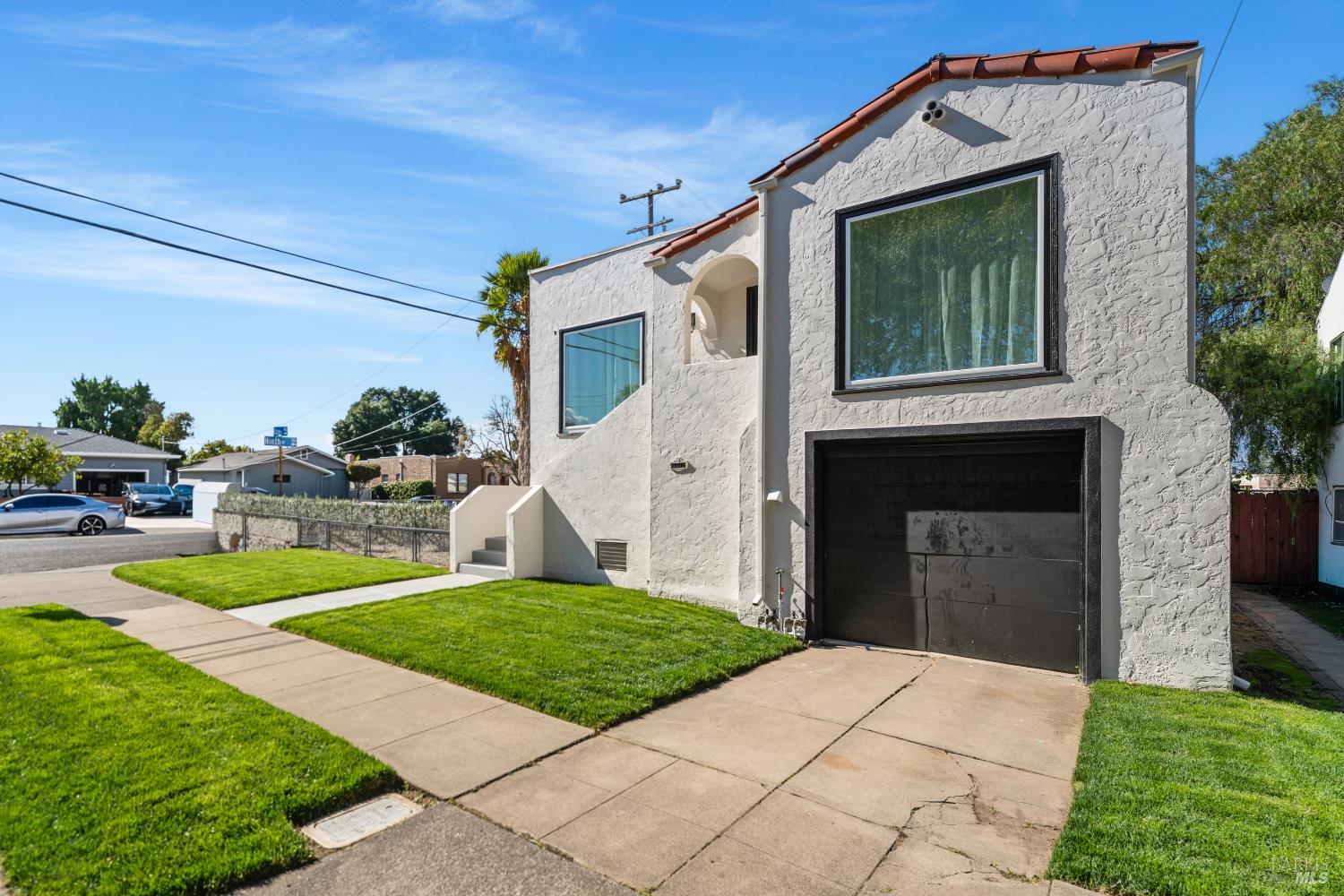1402 Rice Street Vallejo, CA 94590 - Photo 3 of 55 a front view of a house with a yard