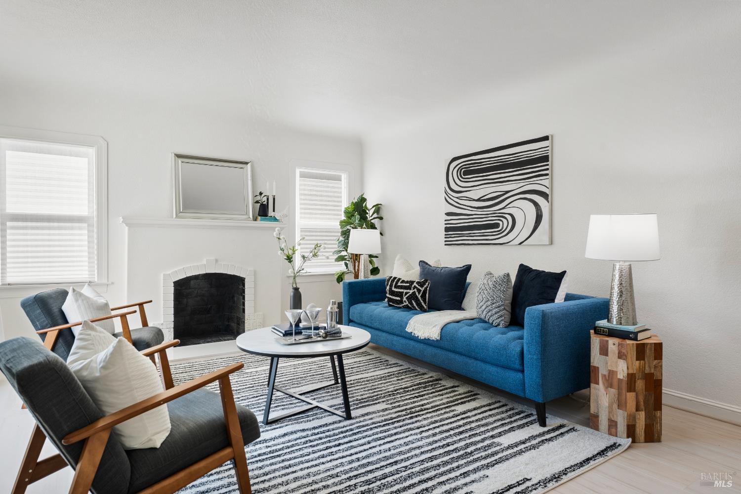 1402 Rice Street Vallejo, CA 94590 - Photo 51 of 55 a living room with furniture a fireplace and a table