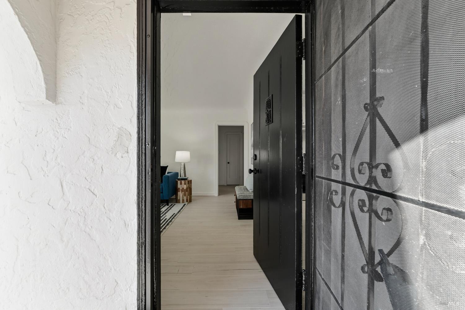 1402 Rice Street Vallejo, CA 94590 - Photo 8 of 55 a view of a hallway with a white walls and stairs