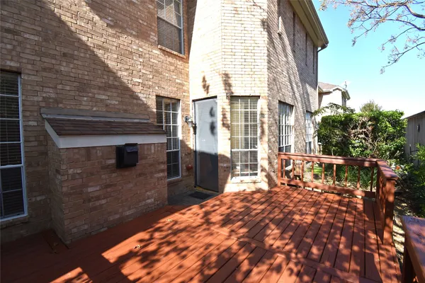 a view of a brick building with many windows