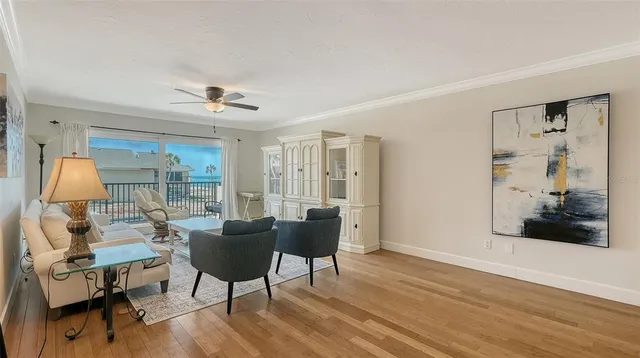 a view of a workspace with furniture and wooden floor